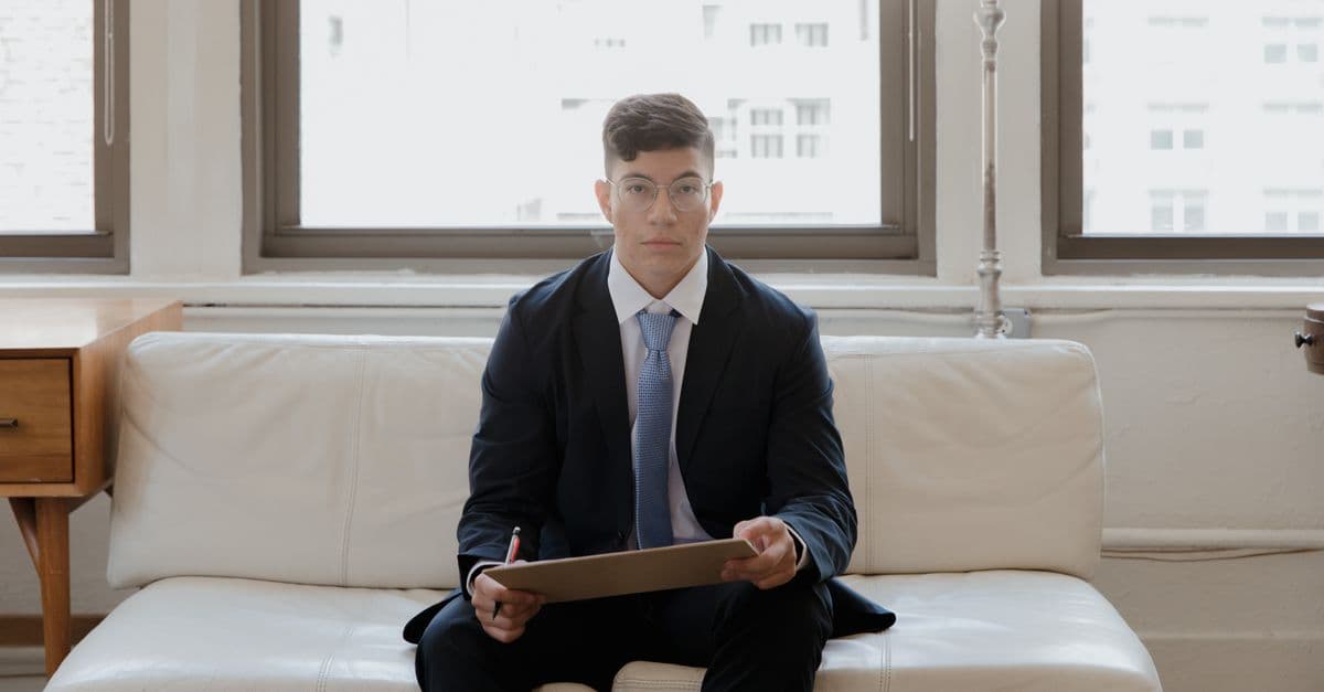 MBA aspirant in a formal panel interview at a business school