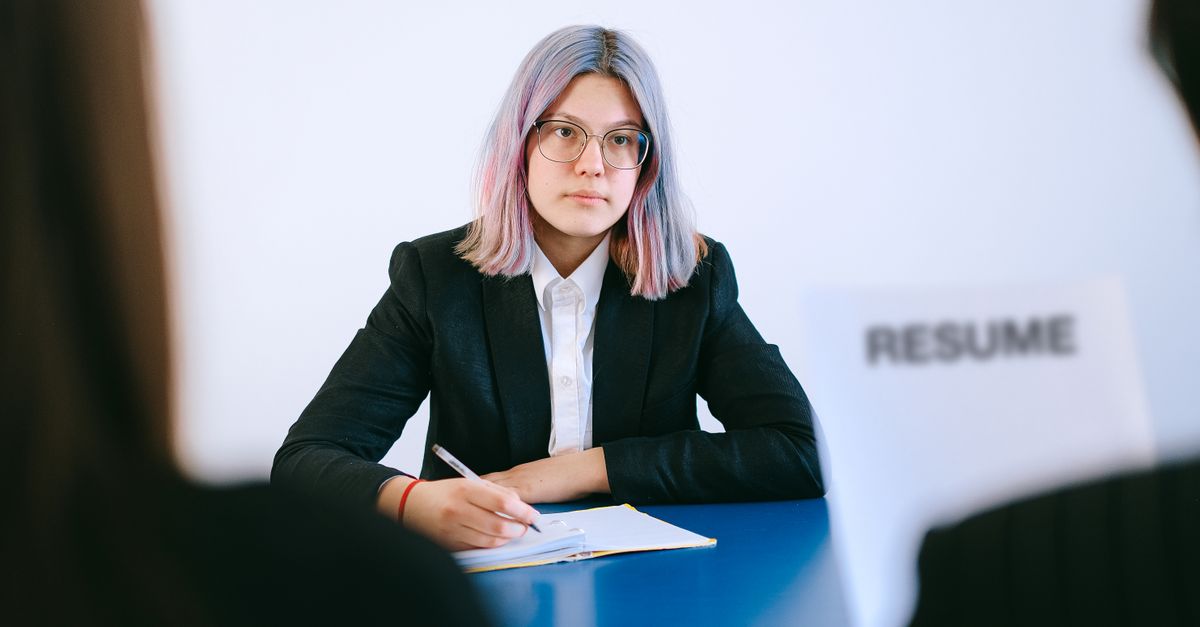 Professional reviewing notes confidently before a job interview